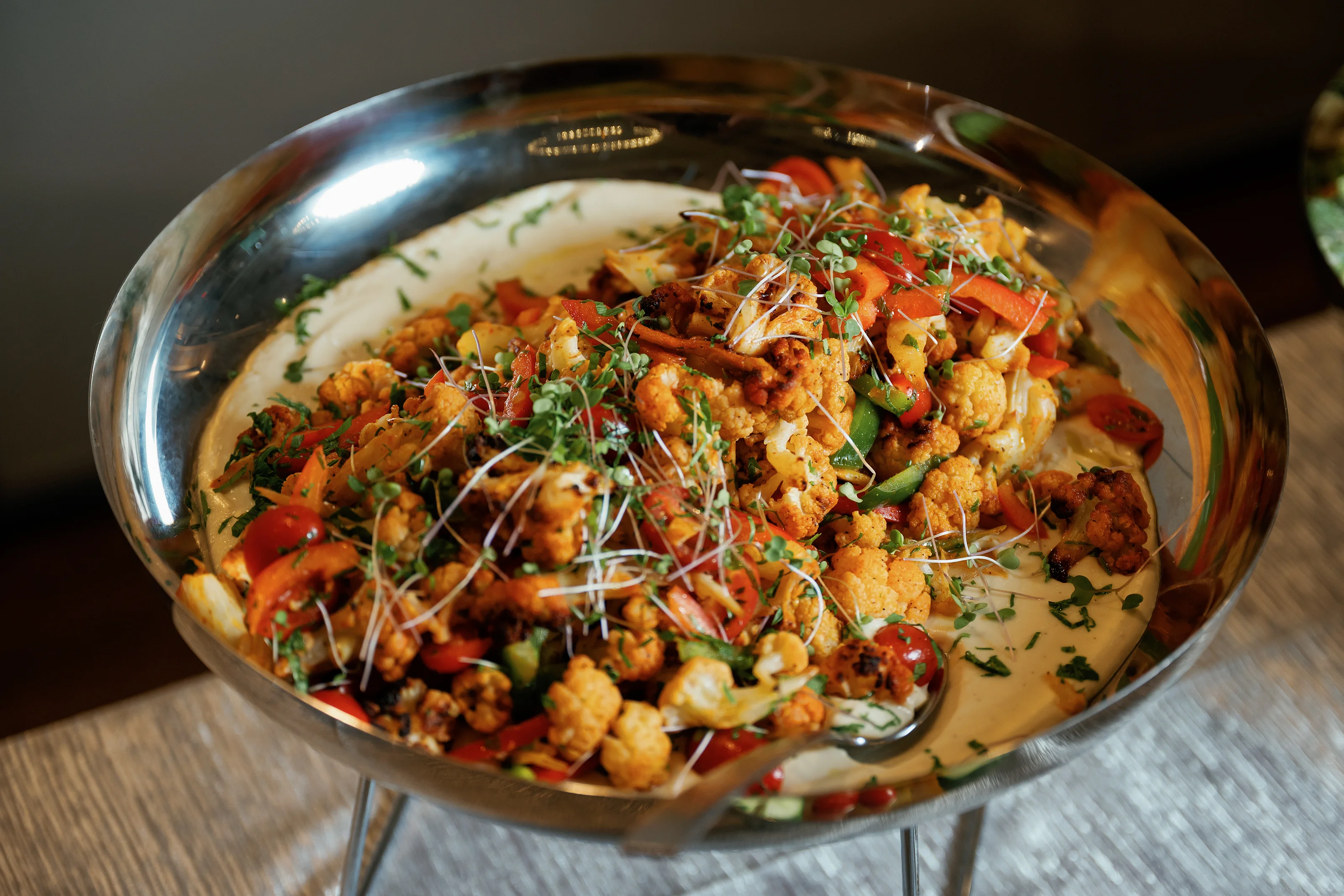 Seasoned grain salad in a catering bowl