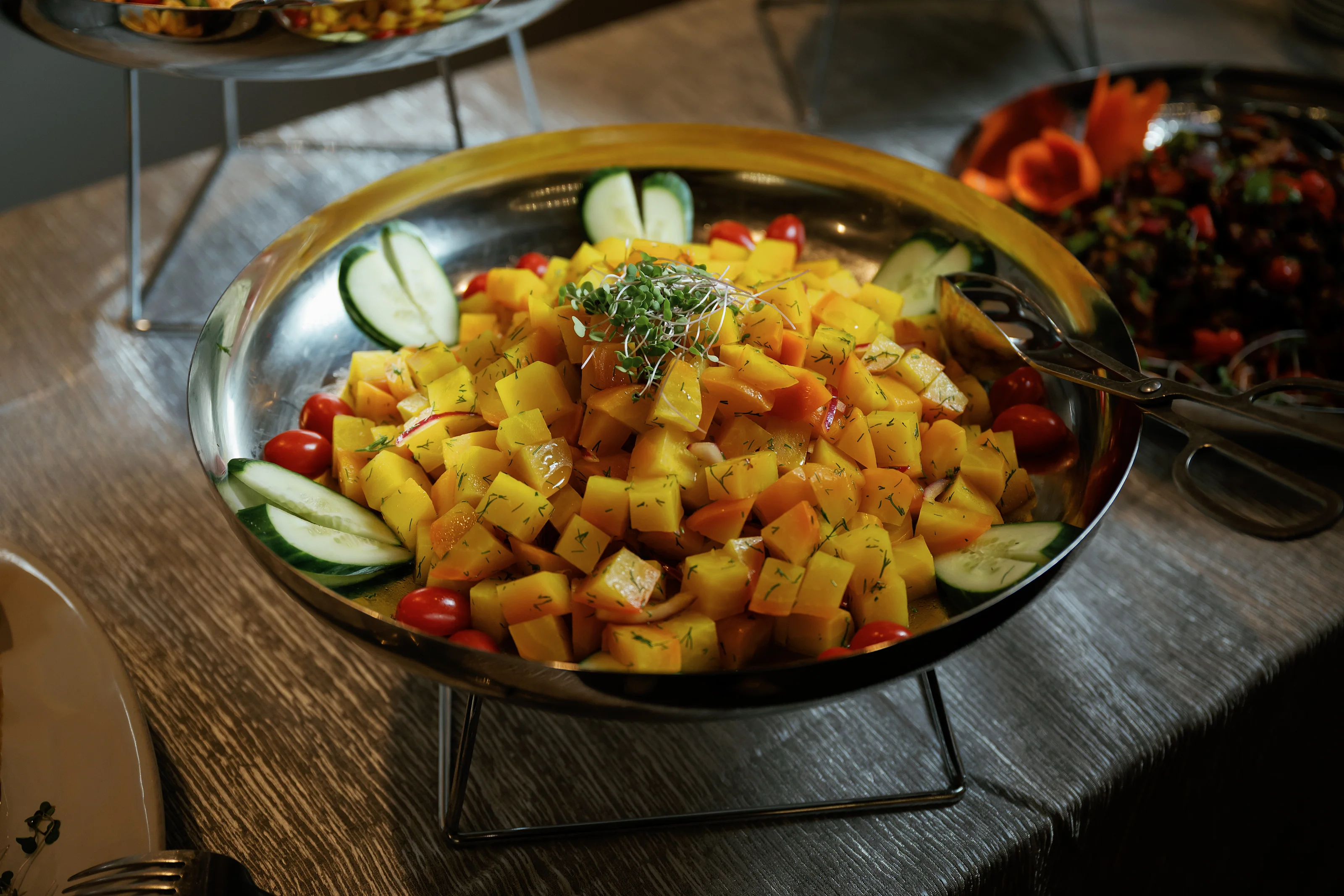 Yellow fruit and vegetable salad with citrus garnish