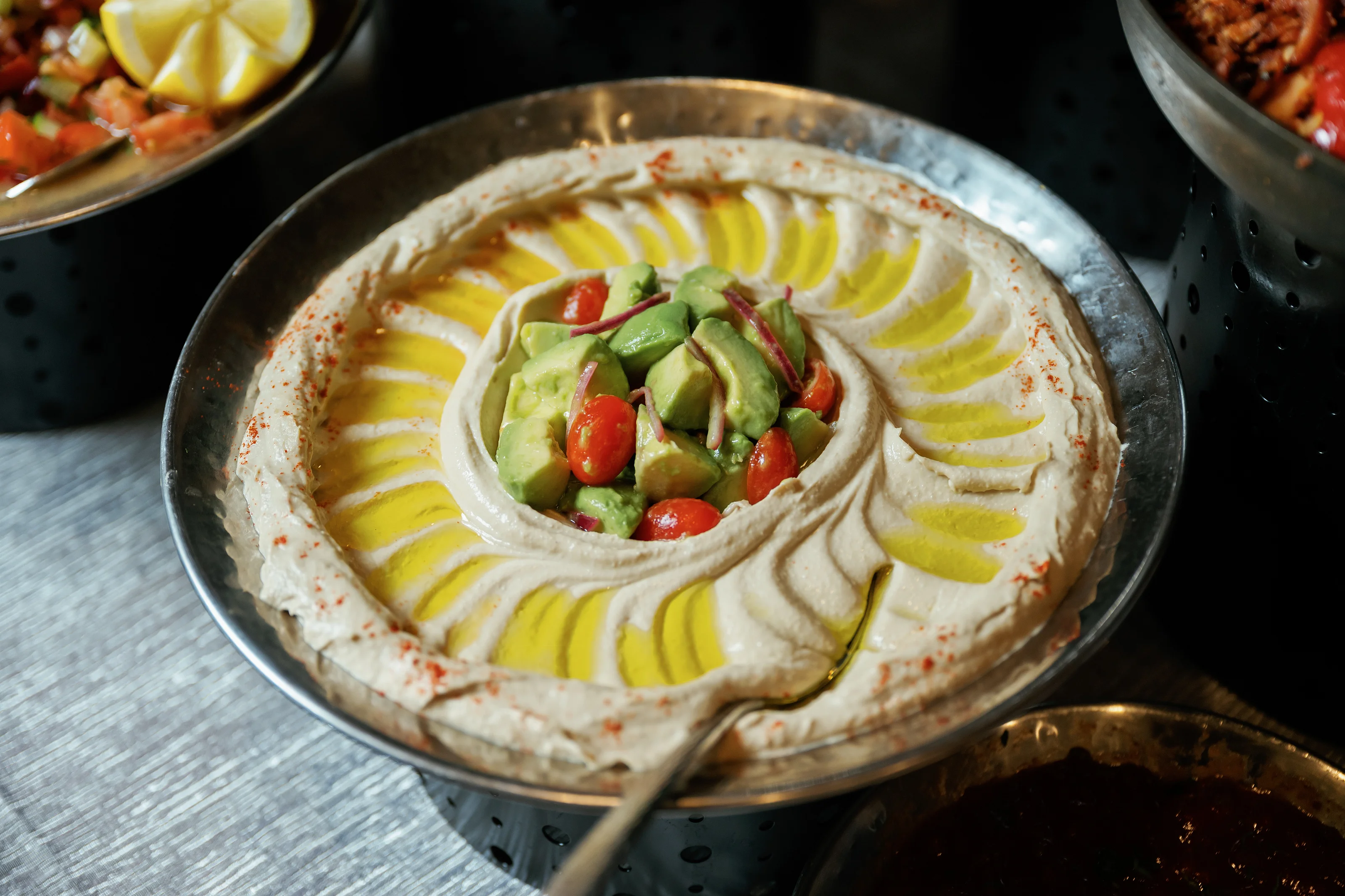 Hummus platter with sliced vegetables