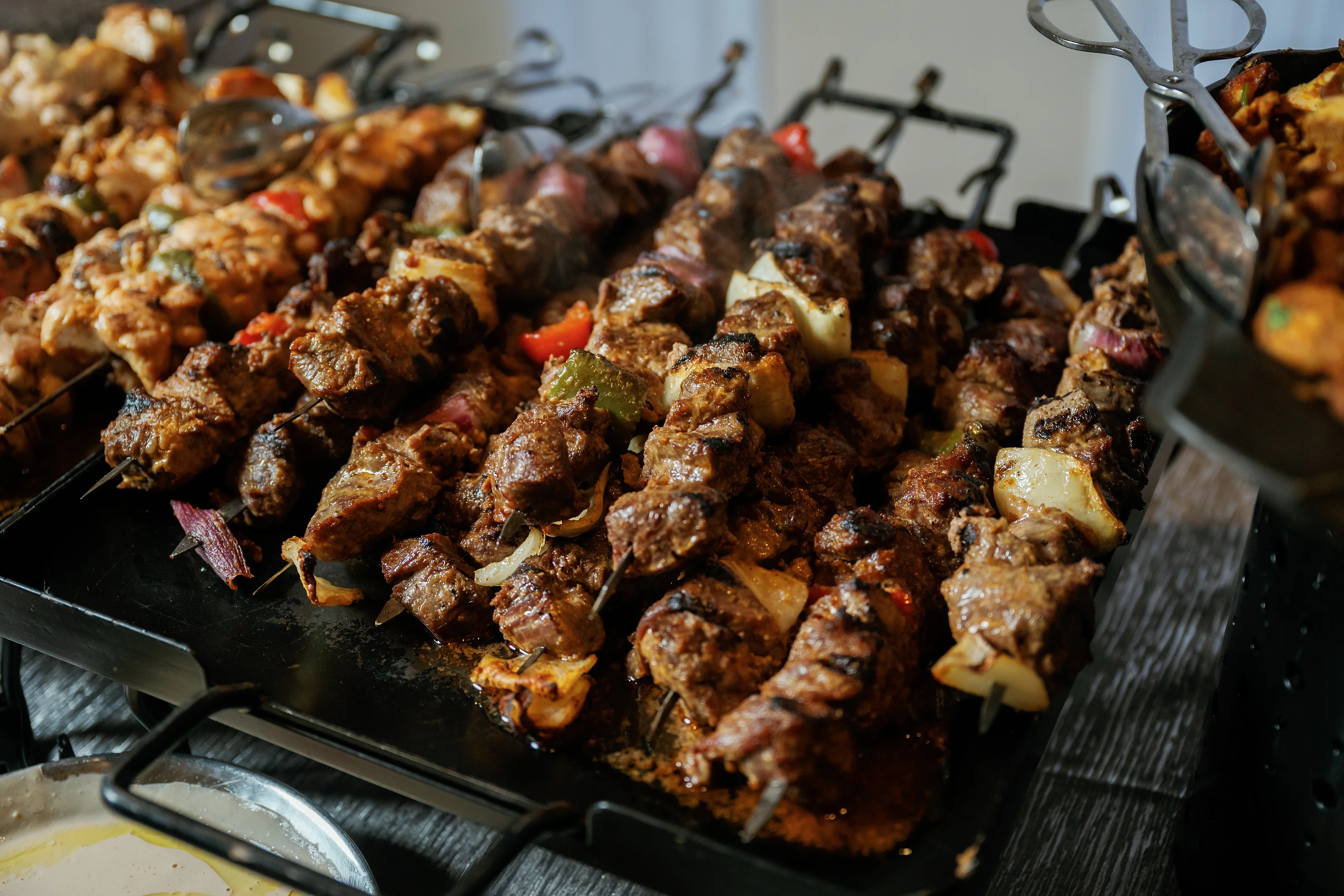 Meat and vegetable skewers on a catering buffet