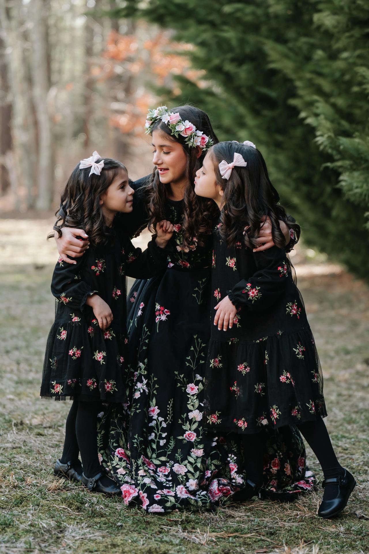 Girls sharing a hug during Bat Mitzvah portraits