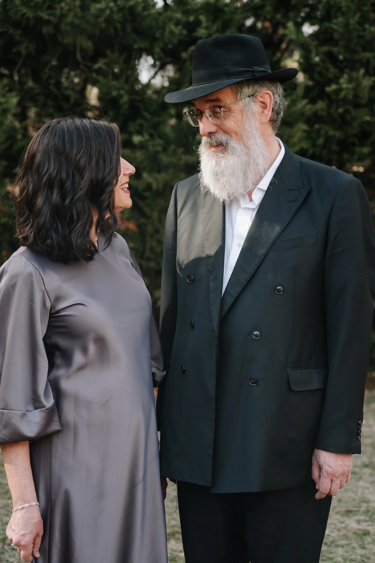 Older couple sharing a smile during outdoor family portraits