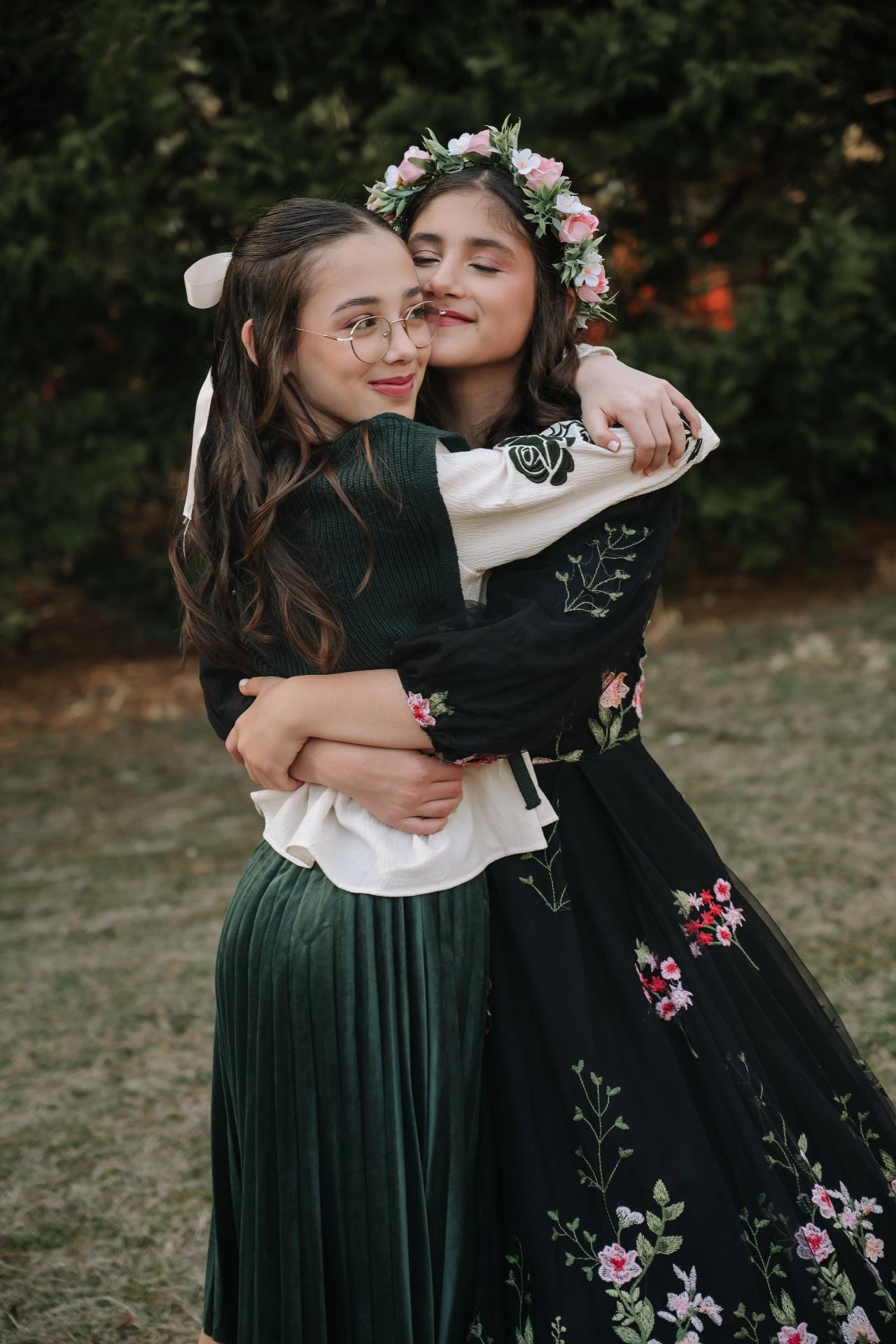 Two girls hugging during the Bat Mitzvah portrait session
