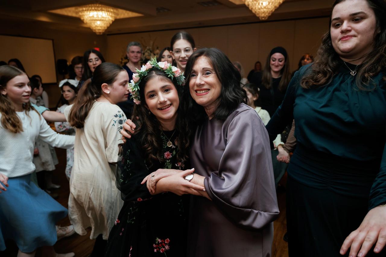 Guests hugging during the Bat Mitzvah reception