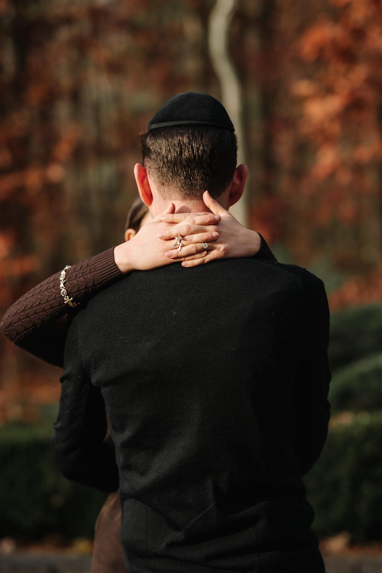 Detail of a couple embracing during an outdoor portrait session