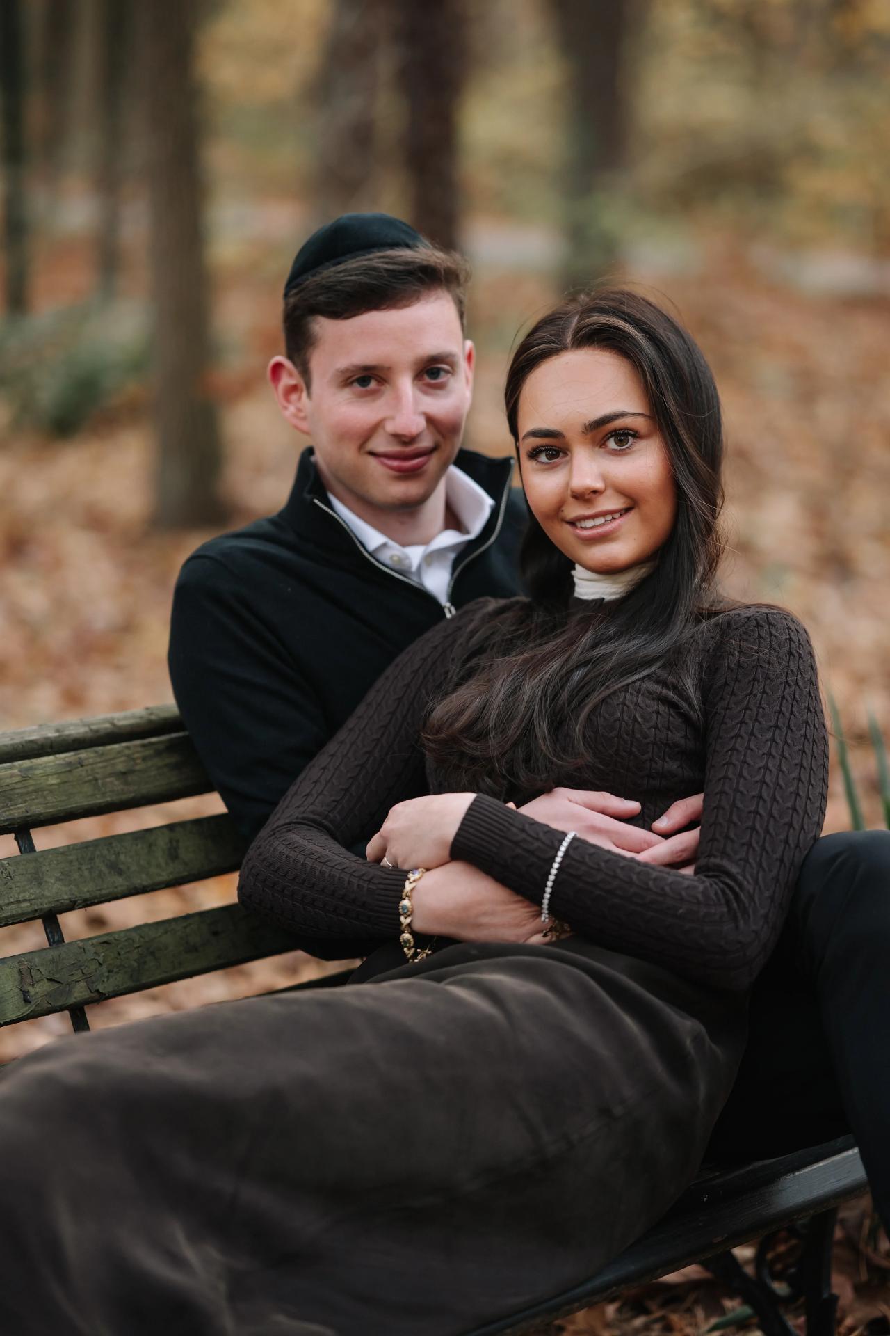 Close portrait of a couple relaxing together on a park bench