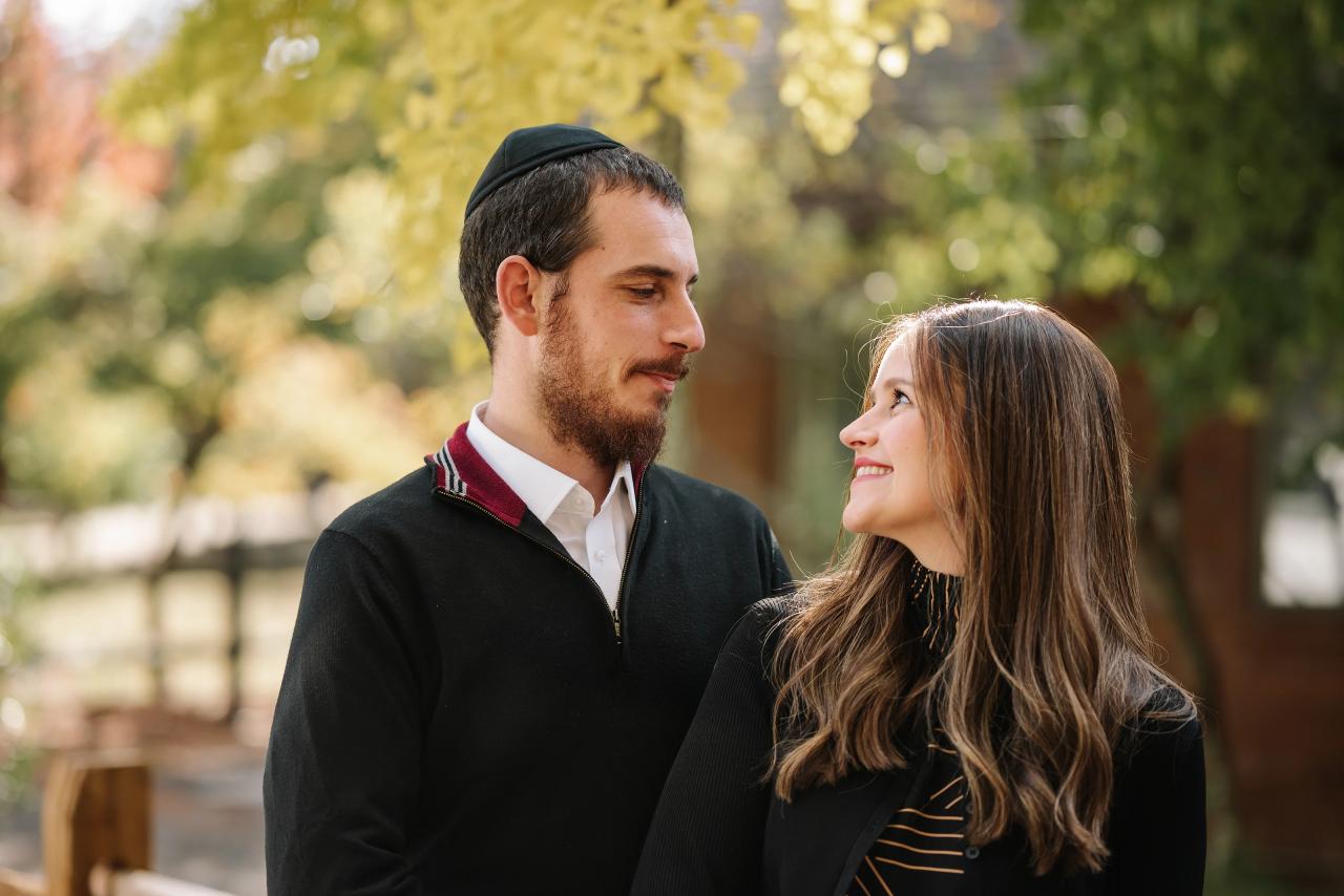 Parents looking at each other during a woodland portrait session
