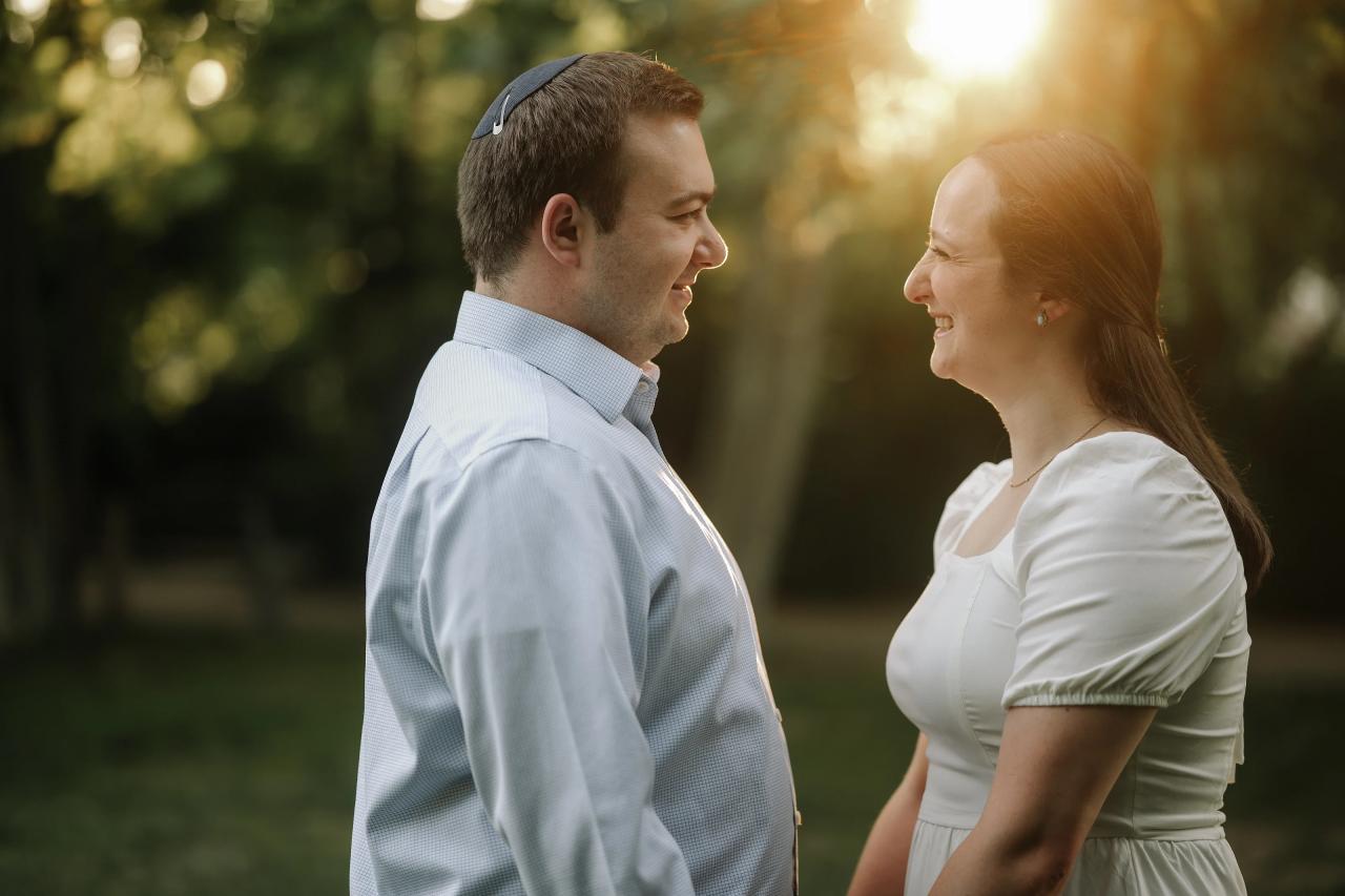 Couple smiling at each other in warm evening light