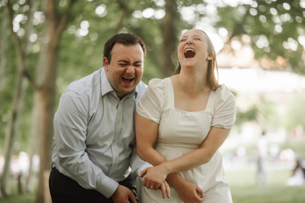 Couple laughing together during their engagement session