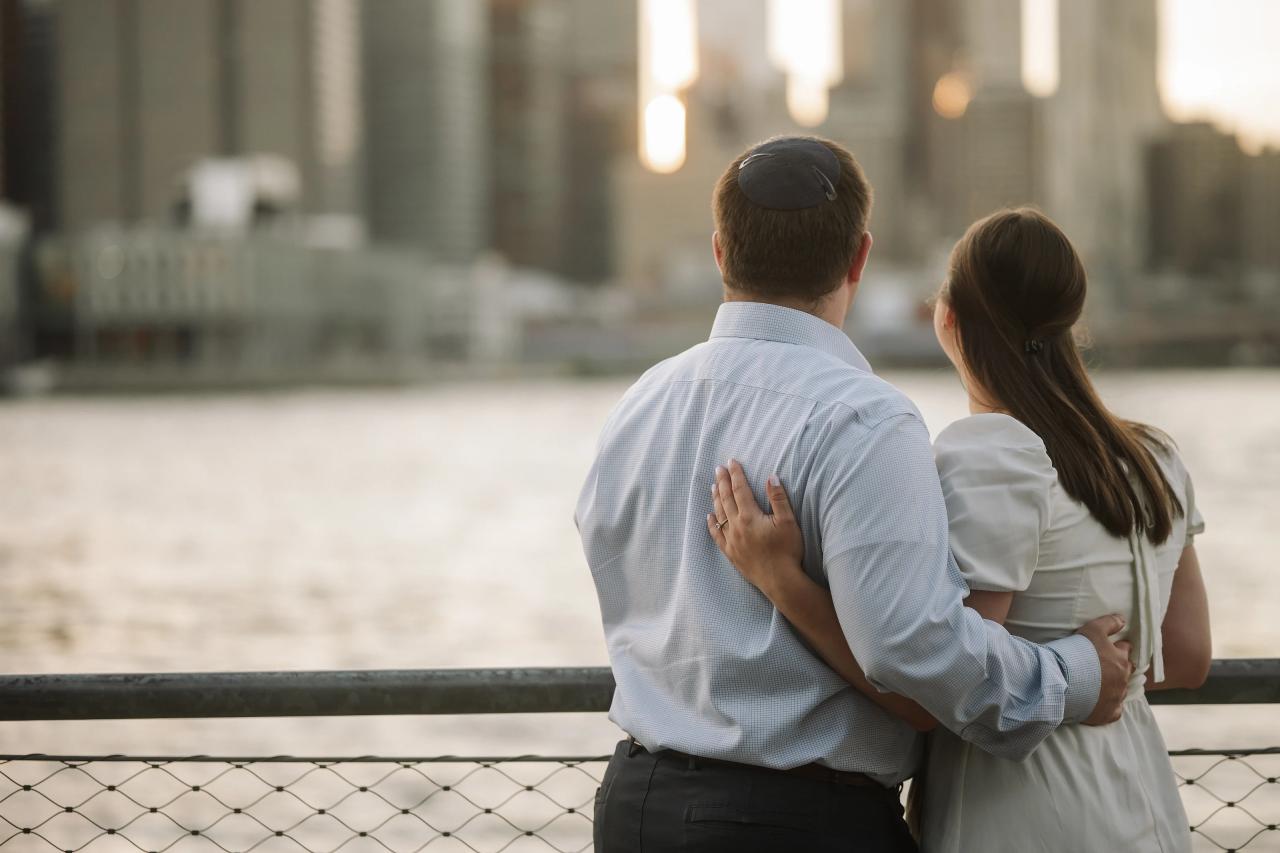 Couple looking across the waterfront toward the city skyline