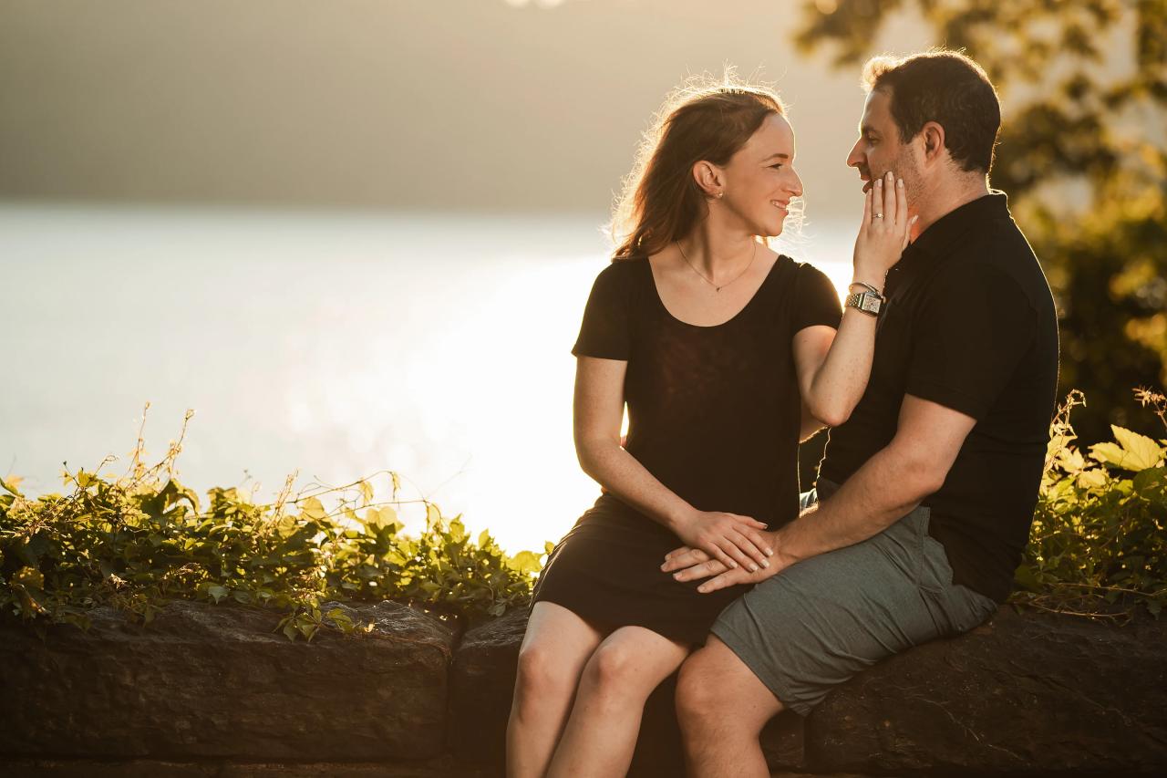 Couple smiling at each other during a sunset engagement portrait