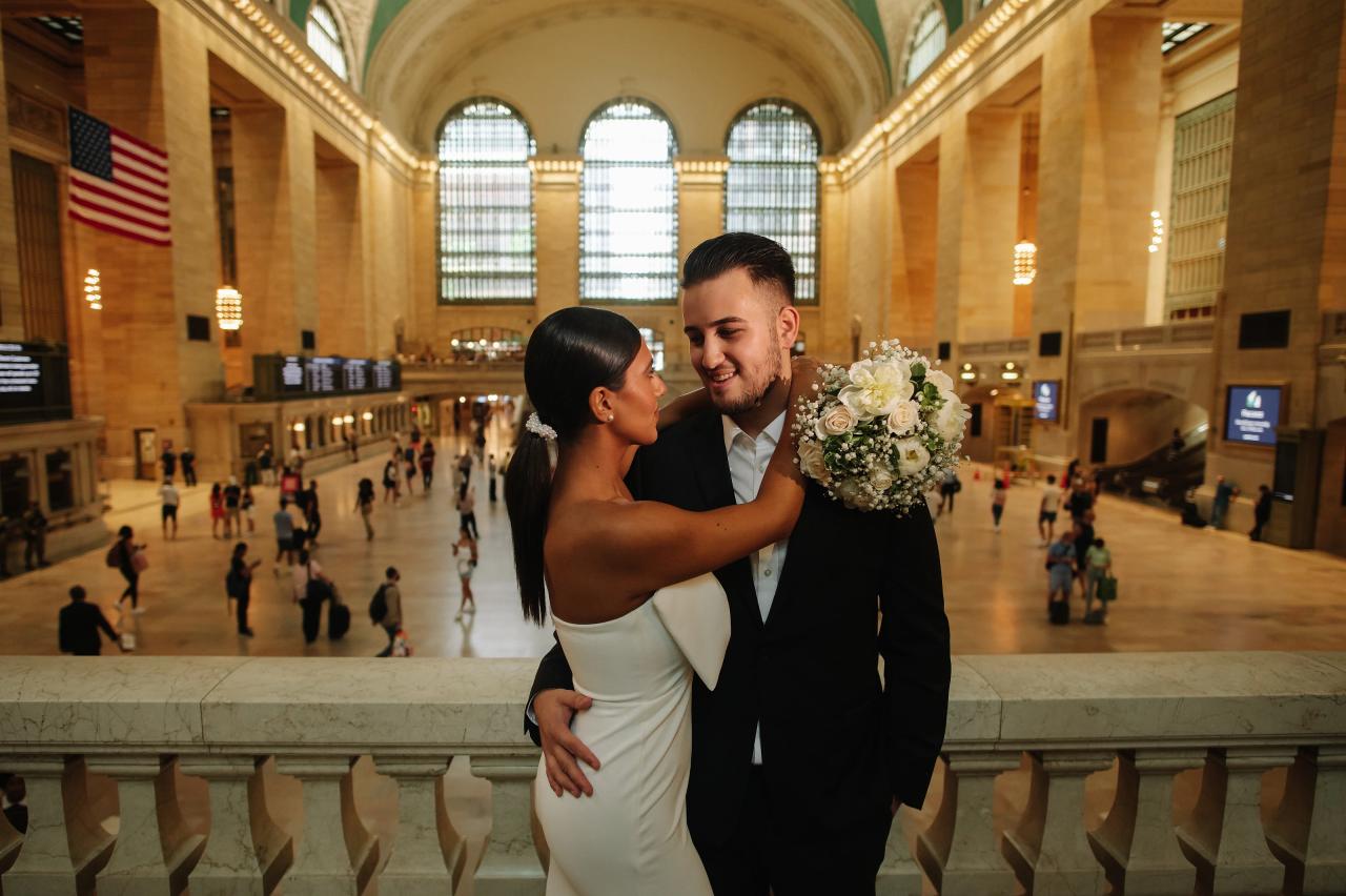 Couple sharing an embrace above the main concourse at Grand Central