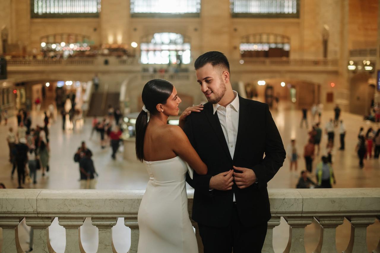 Couple smiling at each other during engagement portraits at Grand Central