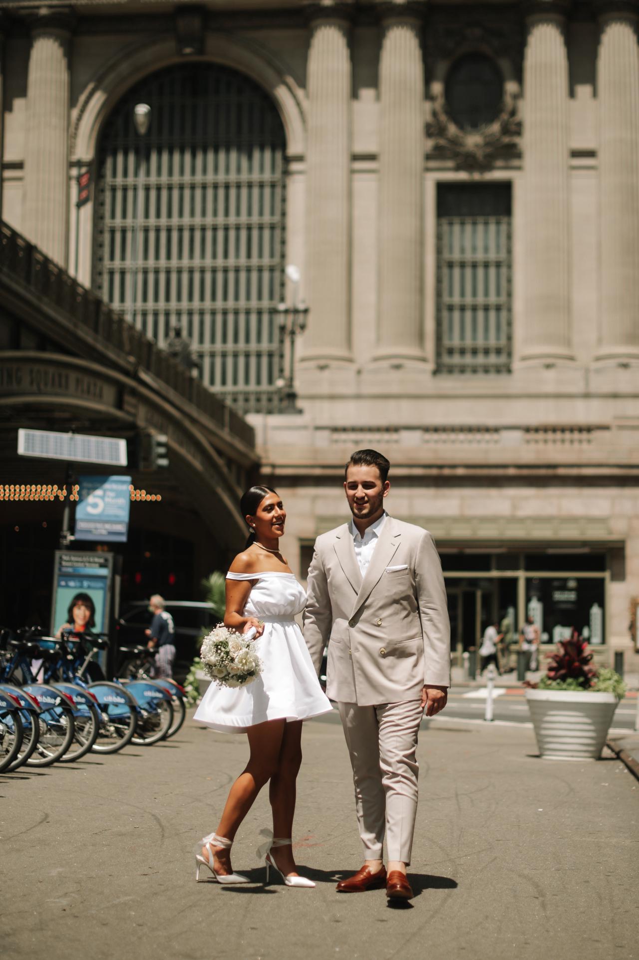 Couple smiling together outside the Grand Central entrance