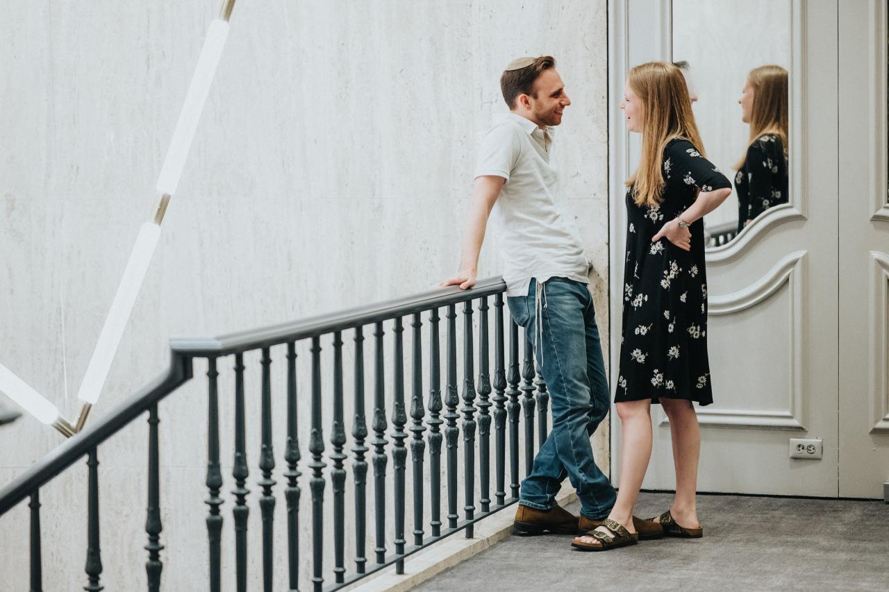 Couple standing on a stair landing