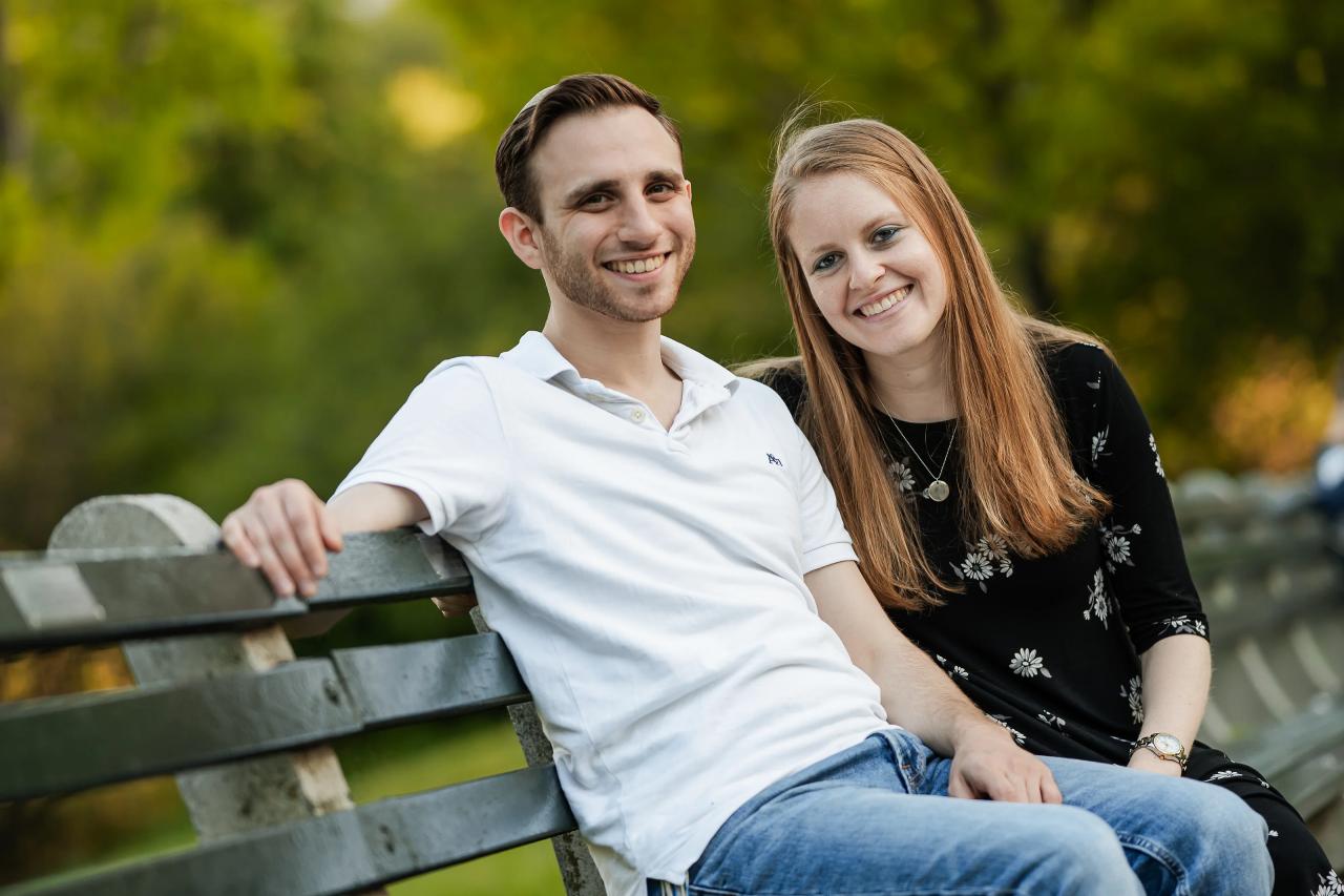 Close portrait of a couple sitting on a park bench