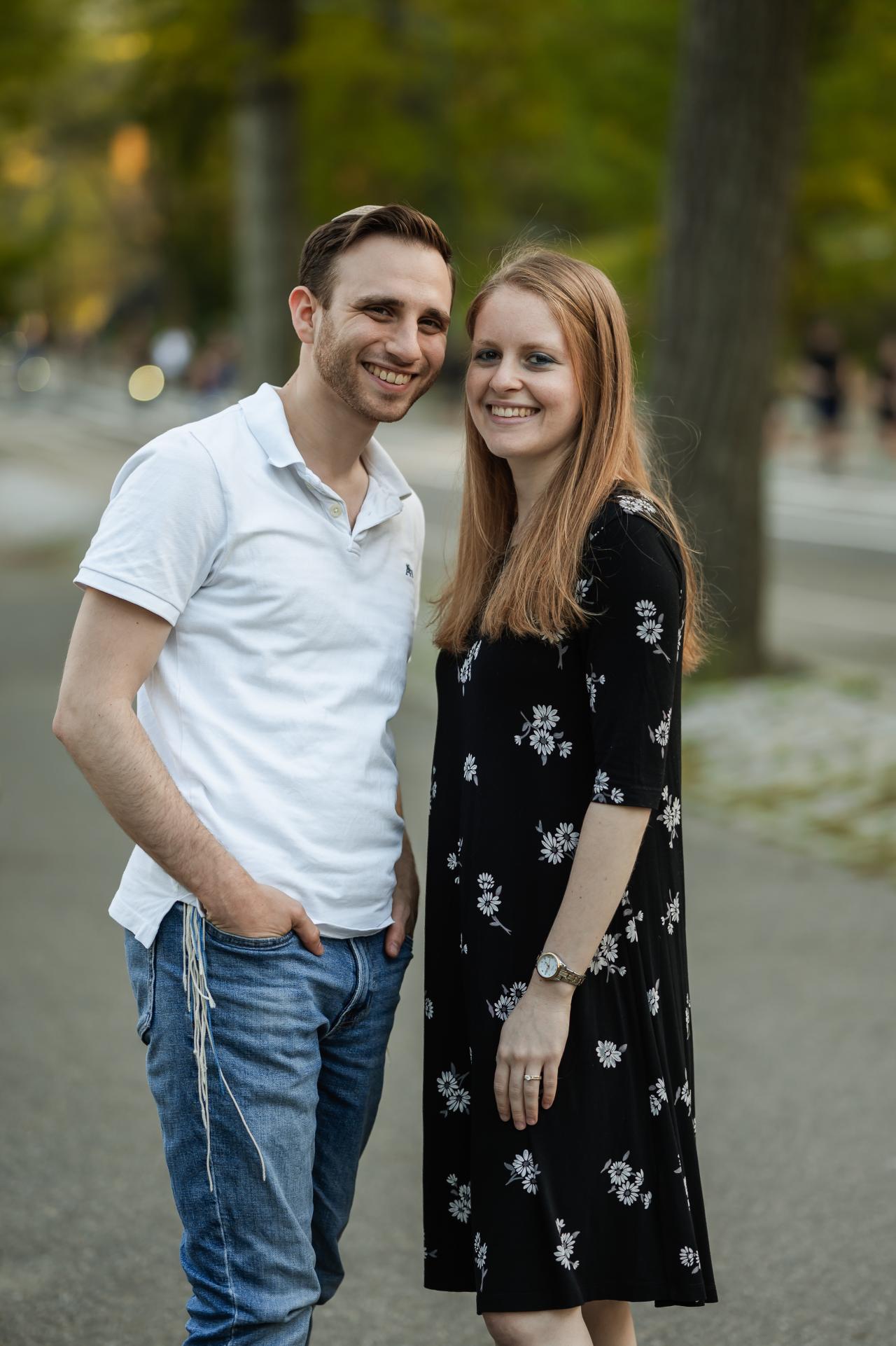 Engagement portrait on a tree-lined path