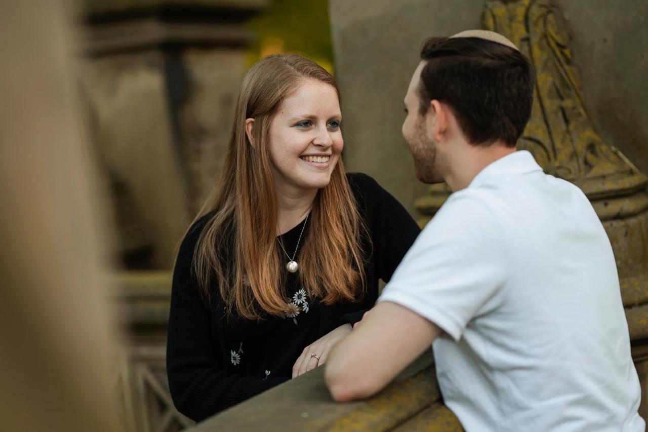 Close portrait of a smiling couple at a stone terrace