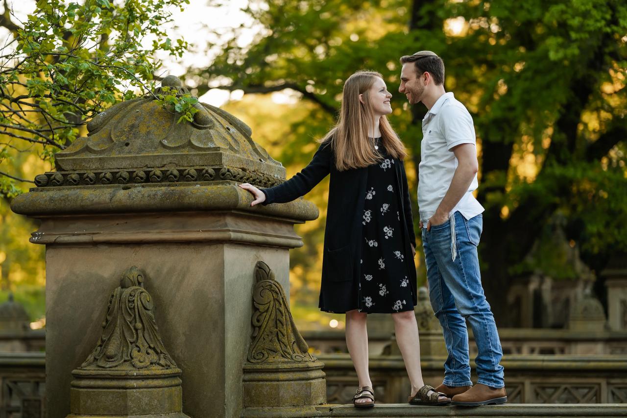 Couple facing each other on a stone terrace