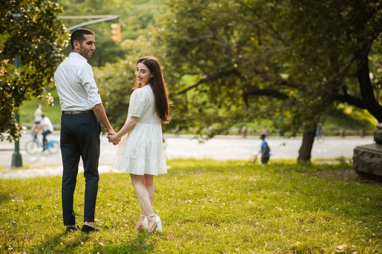 Couple holding hands in warm evening light