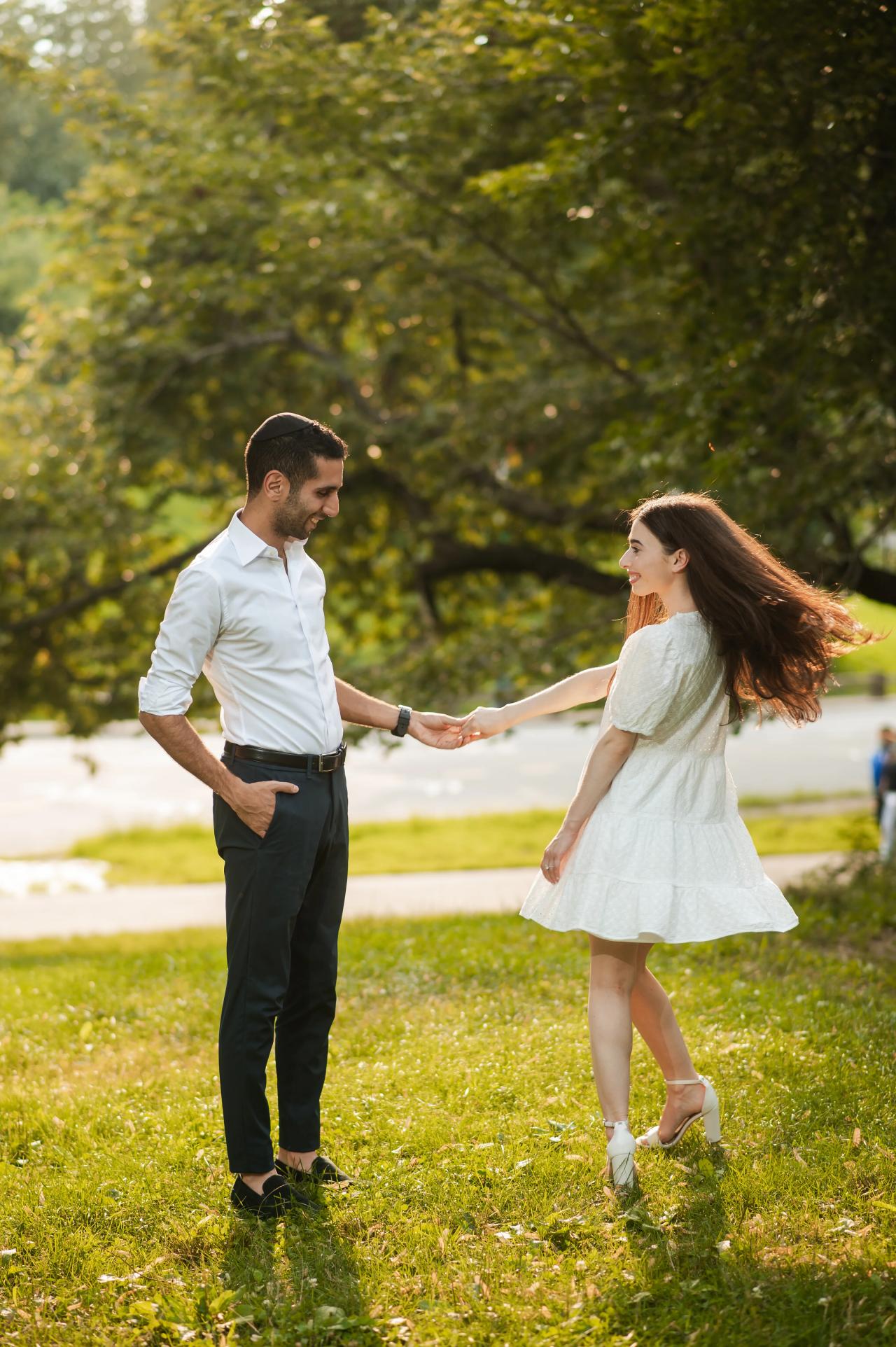 Playful twirl during a Central Park engagement session