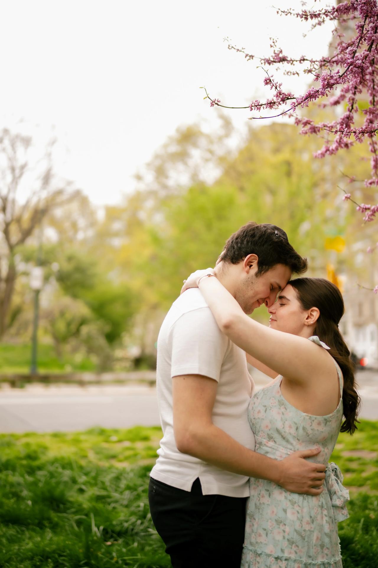 Couple sharing a quiet moment among spring trees
