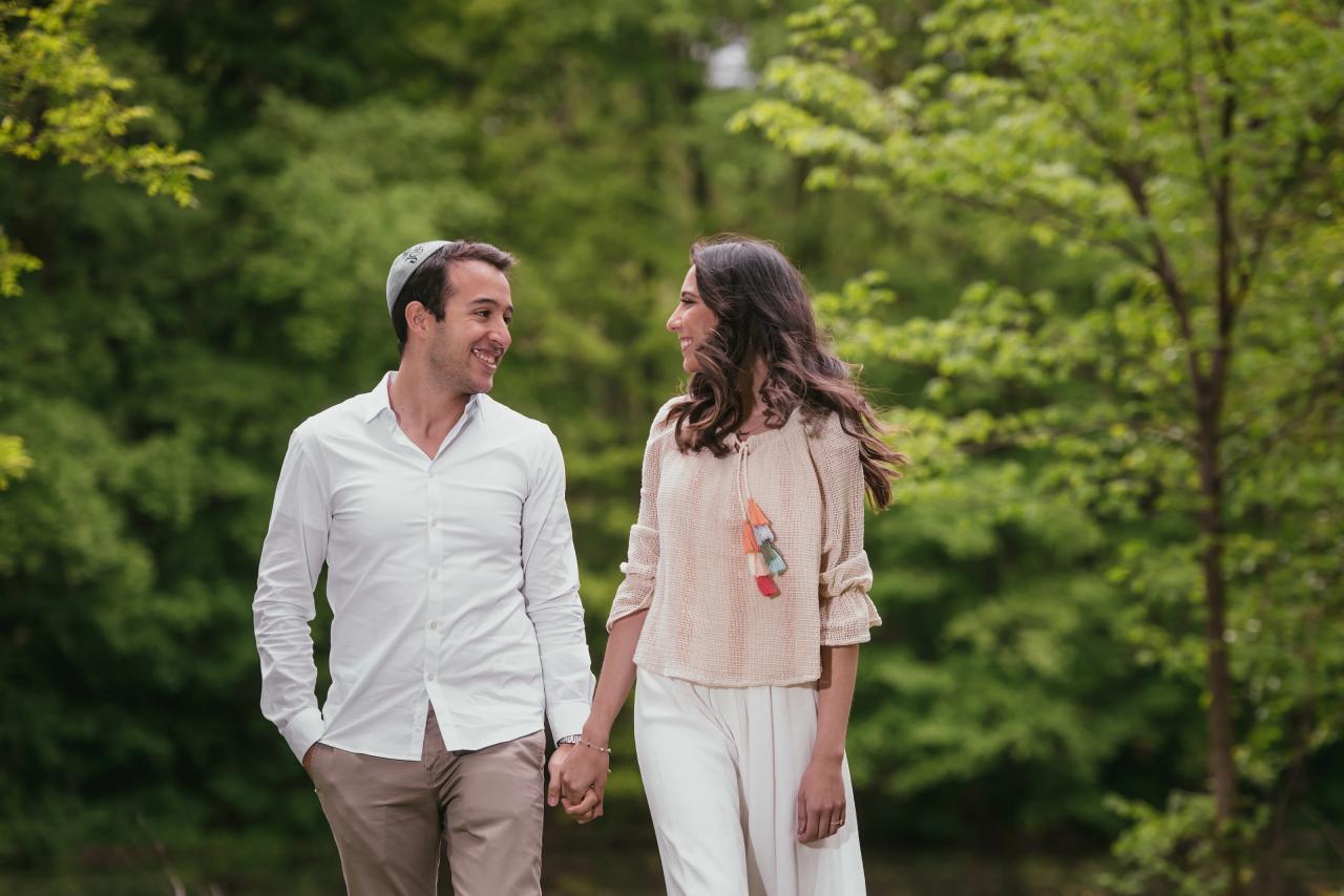 Couple smiling while walking hand in hand