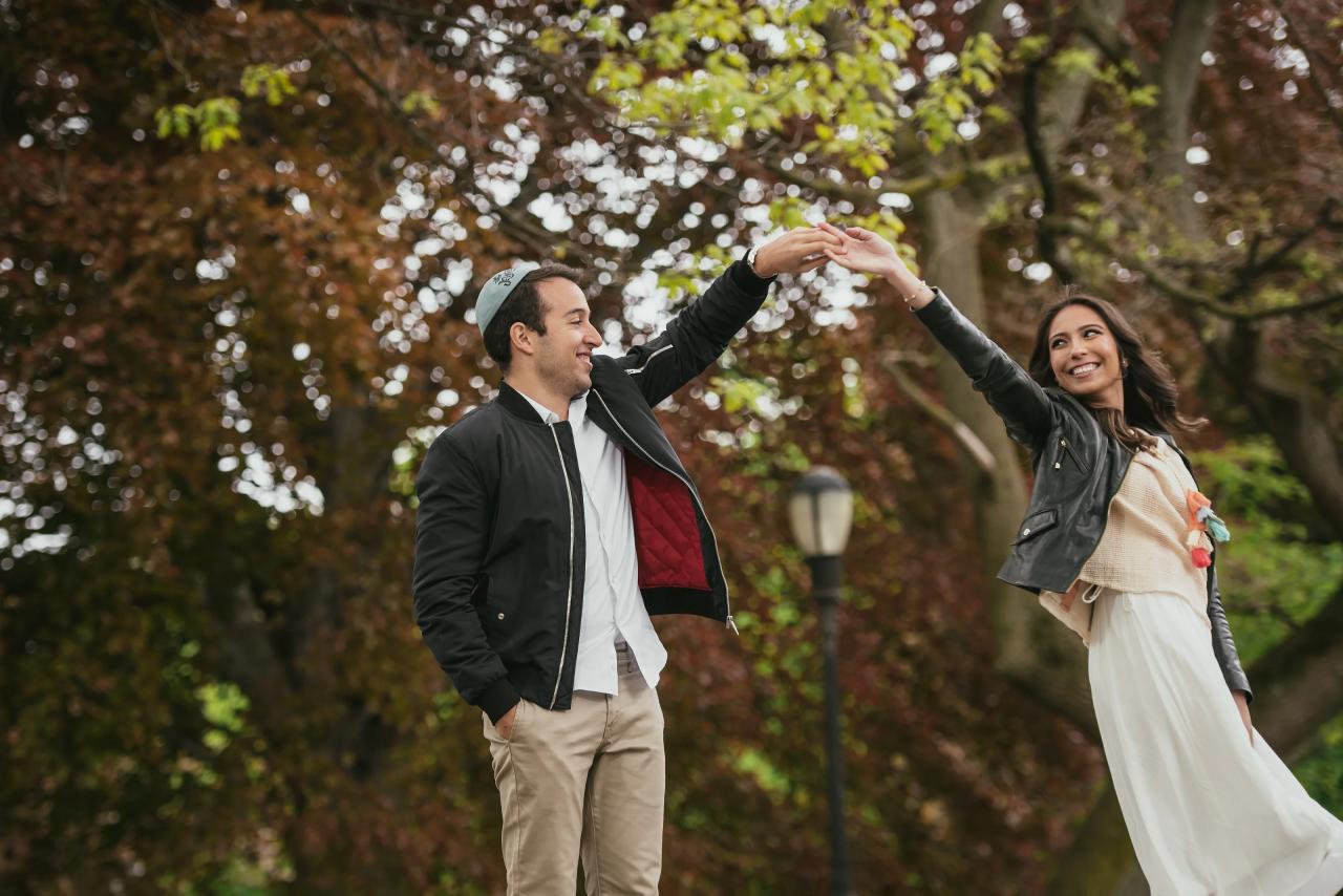 Playful twirl during an outdoor engagement session
