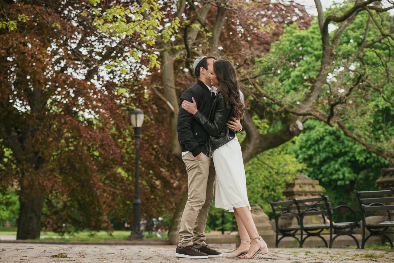 Couple embracing on a shaded park path