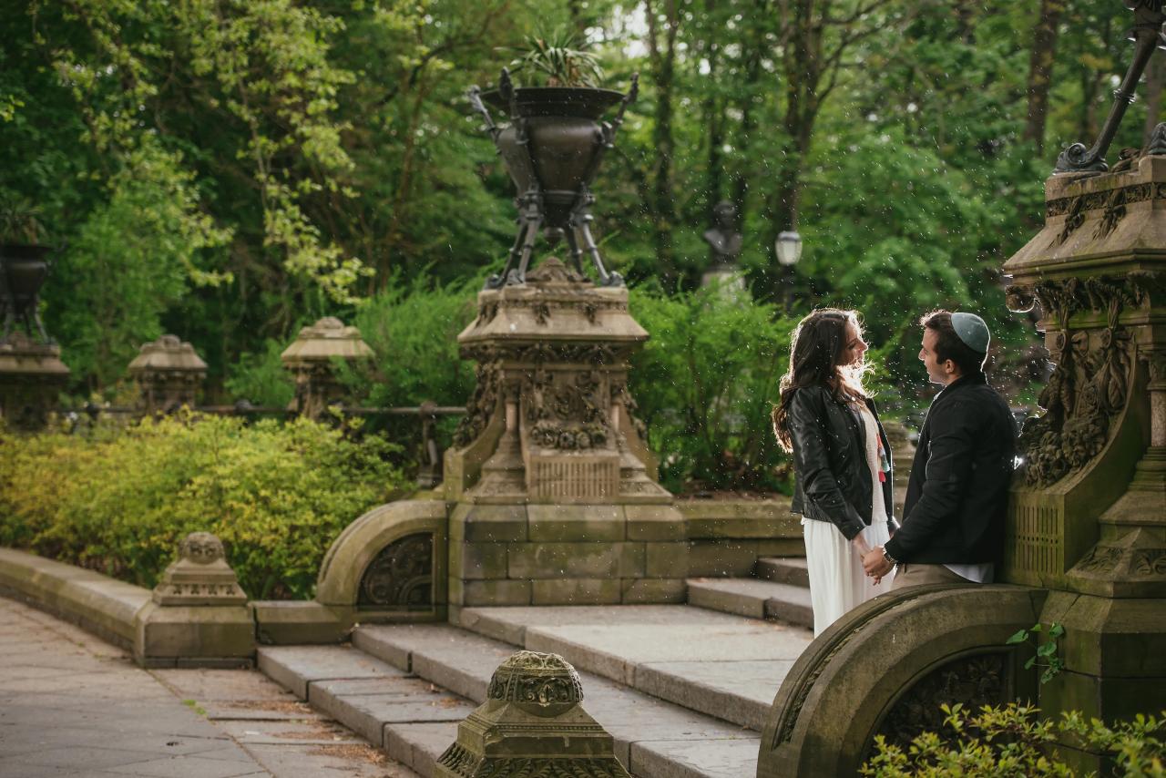 Couple standing together on a carved stone stairway