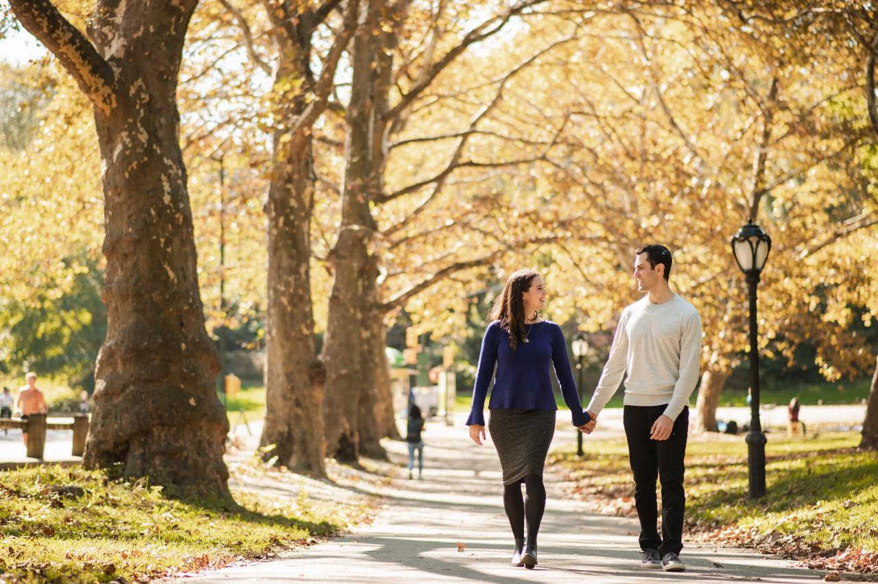 Couple walking toward the camera through warm autumn light