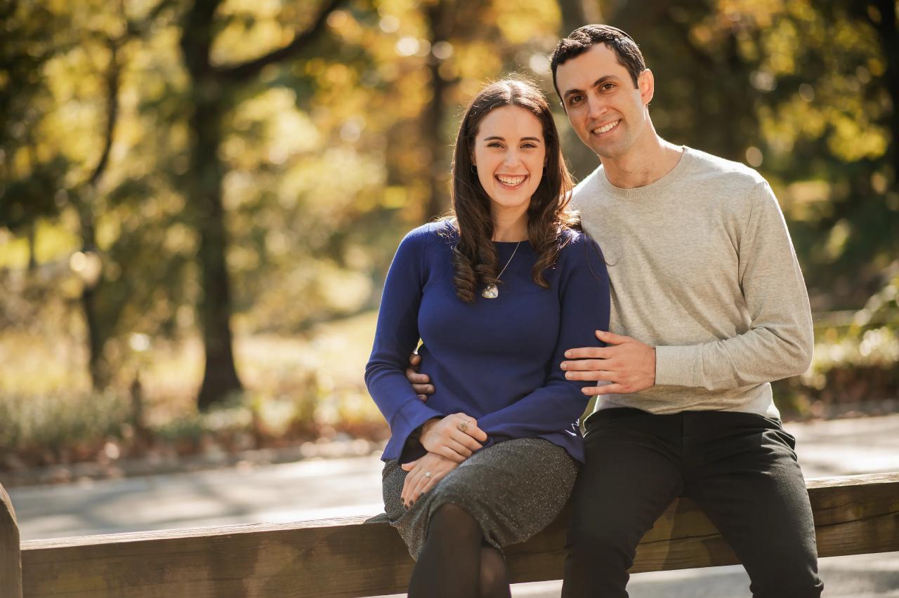 Relaxed seated engagement portrait in soft golden light