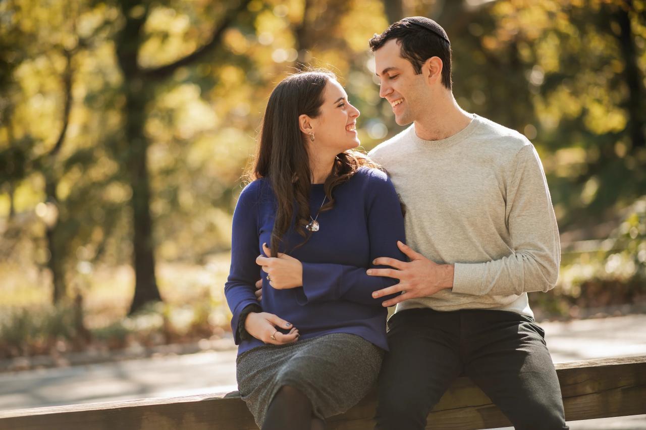 Couple sharing a candid laugh during an autumn engagement session