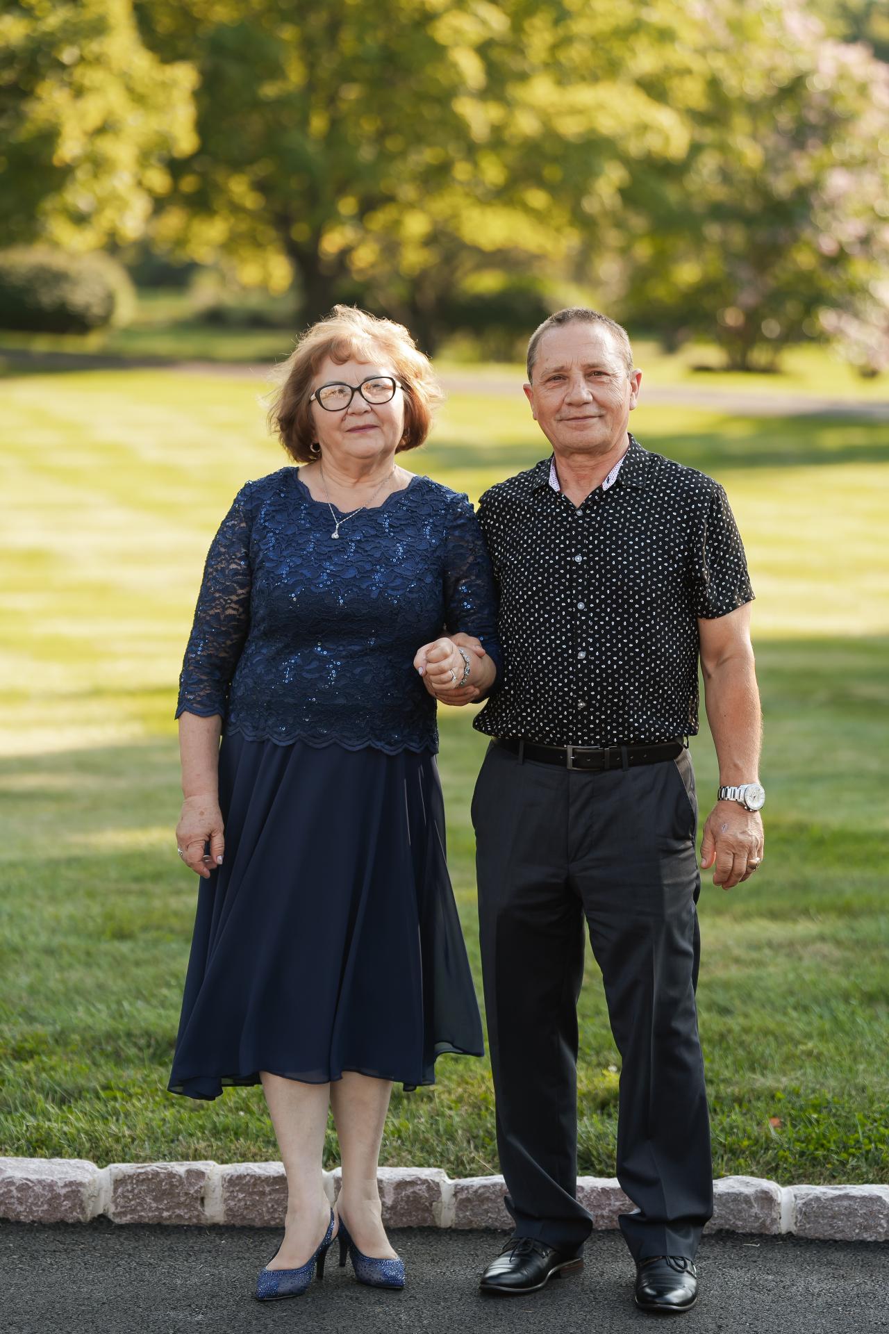 Two guests standing together for an outdoor portrait