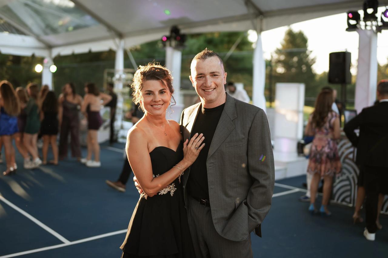 Two guests posing together at the tented bat mitzvah reception