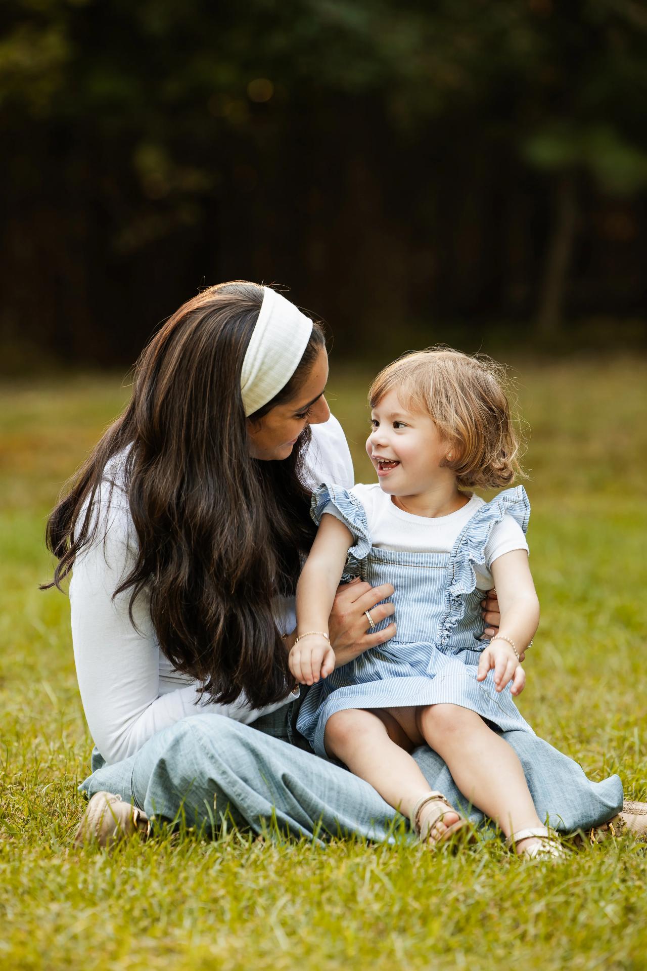 Mother and daughter sharing a smile during their fall family session