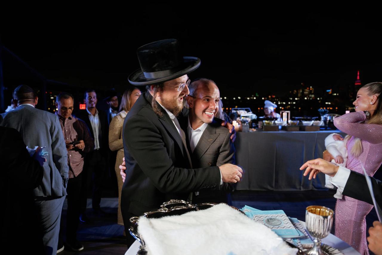 Family gathered around the table as the Pidyon Haben ceremony begins