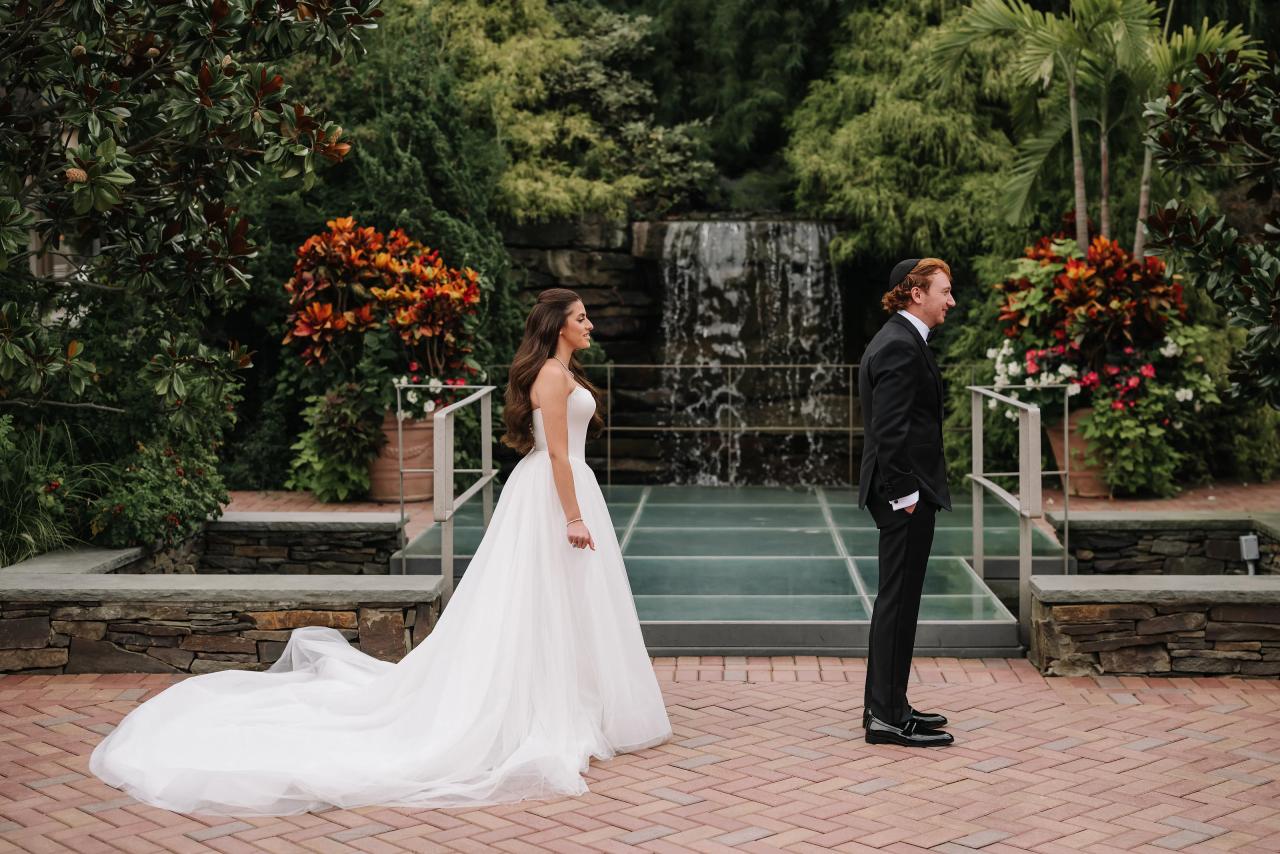 Bride approaching the groom for their first look. Crest Hollow wedding in Woodbury, Long Island.