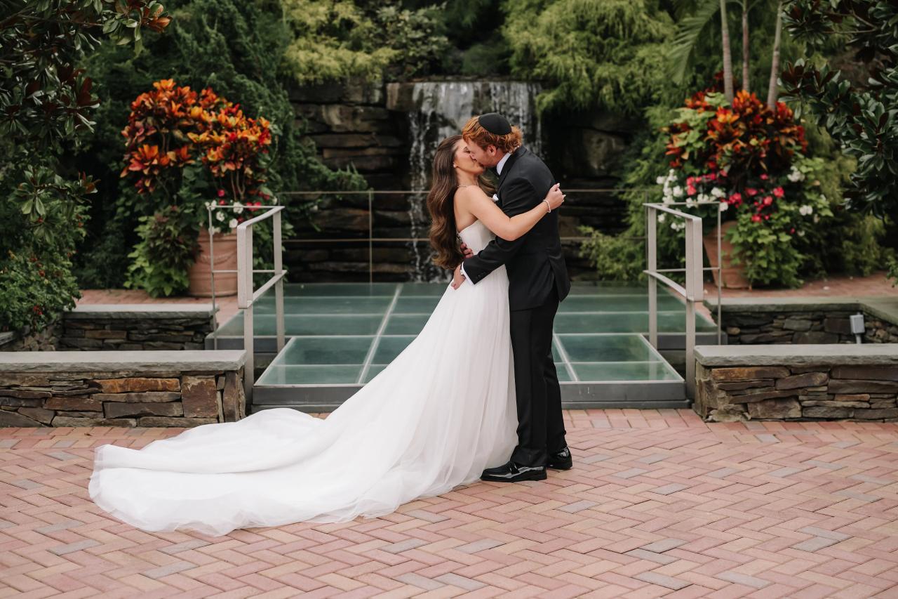 Bride and groom embracing during their first look. Crest Hollow wedding in Woodbury, Long Island.
