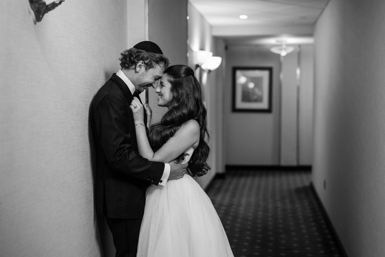 Black-and-white wedding portrait in a quiet corridor. Crest Hollow wedding in Woodbury, Long Island.