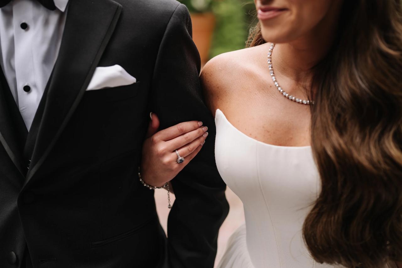 Close detail of the wedding couple holding hands. Crest Hollow wedding in Woodbury, Long Island.