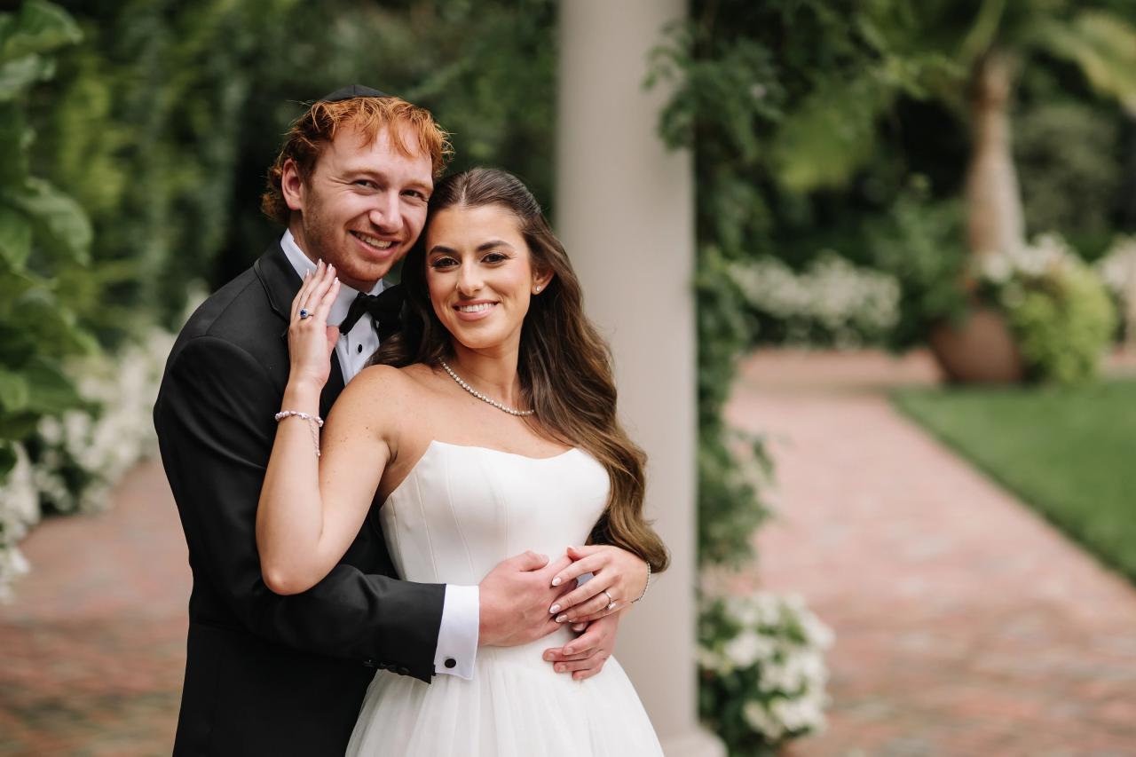 Bride and groom smiling together in the garden. Crest Hollow wedding in Woodbury, Long Island.