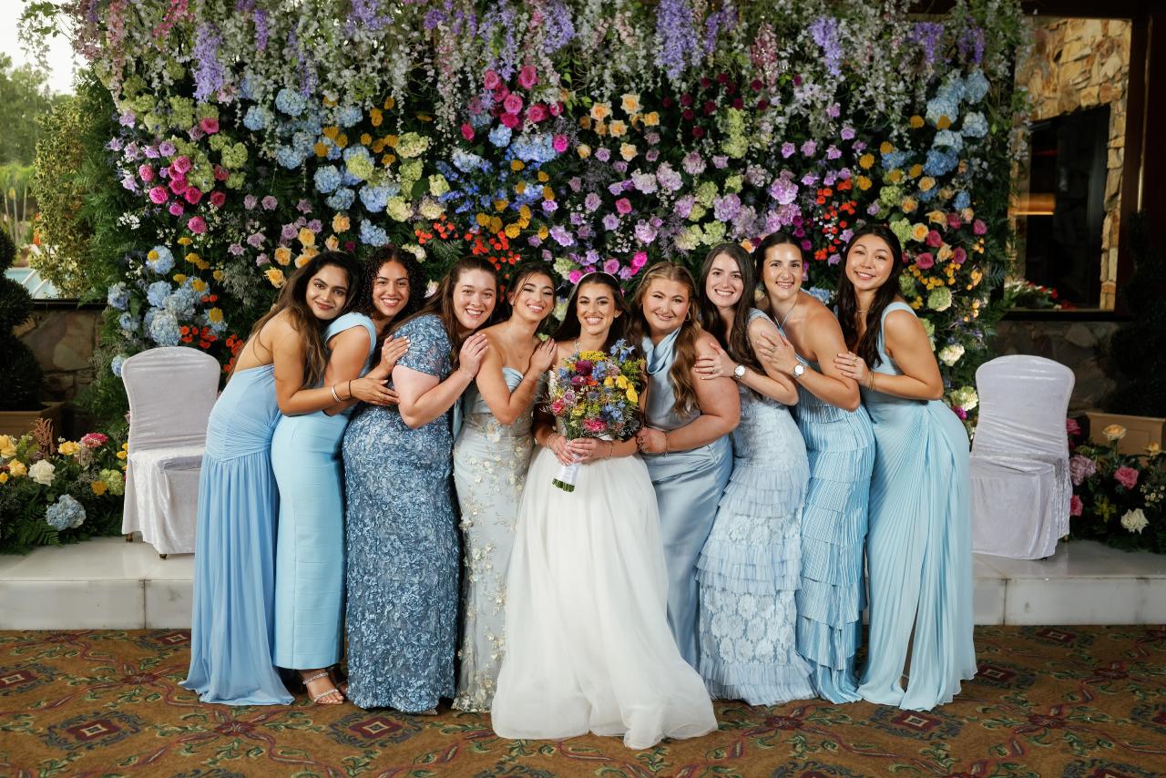 Bride with her wedding party in blue dresses. Crest Hollow wedding in Woodbury, Long Island.