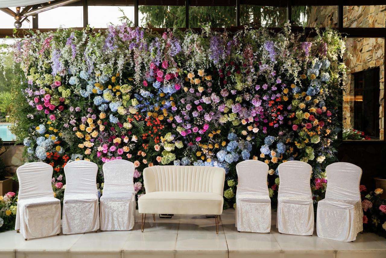 Colorful floral backdrop prepared for the wedding celebration. Crest Hollow wedding in Woodbury, Long Island.