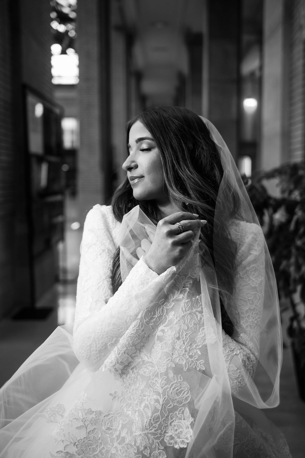 Black-and-white bridal portrait in a quiet corridor. Jewish wedding in Detroit.
