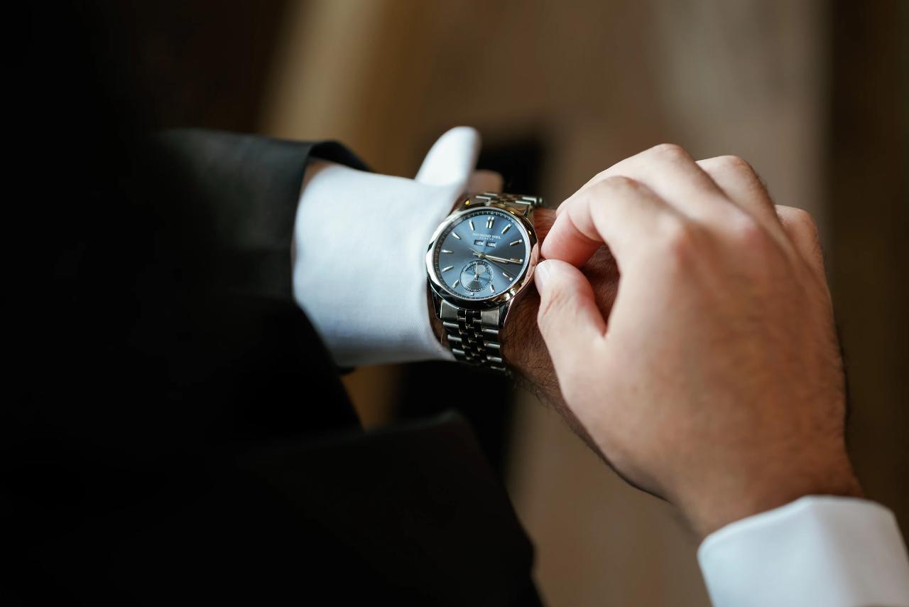 Detail of the groom adjusting his wristwatch. Jewish wedding in Detroit.