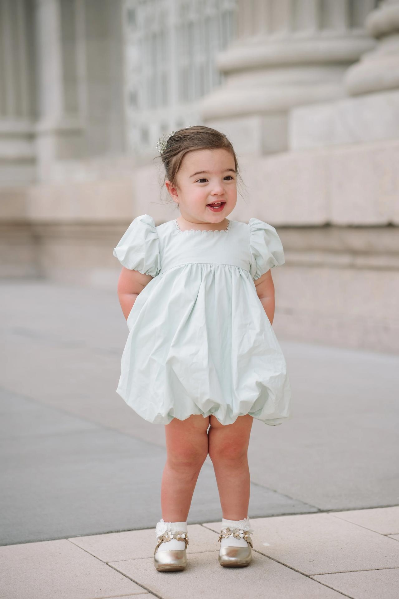 Young wedding guest in a pale blue dress. Jewish wedding in Detroit.
