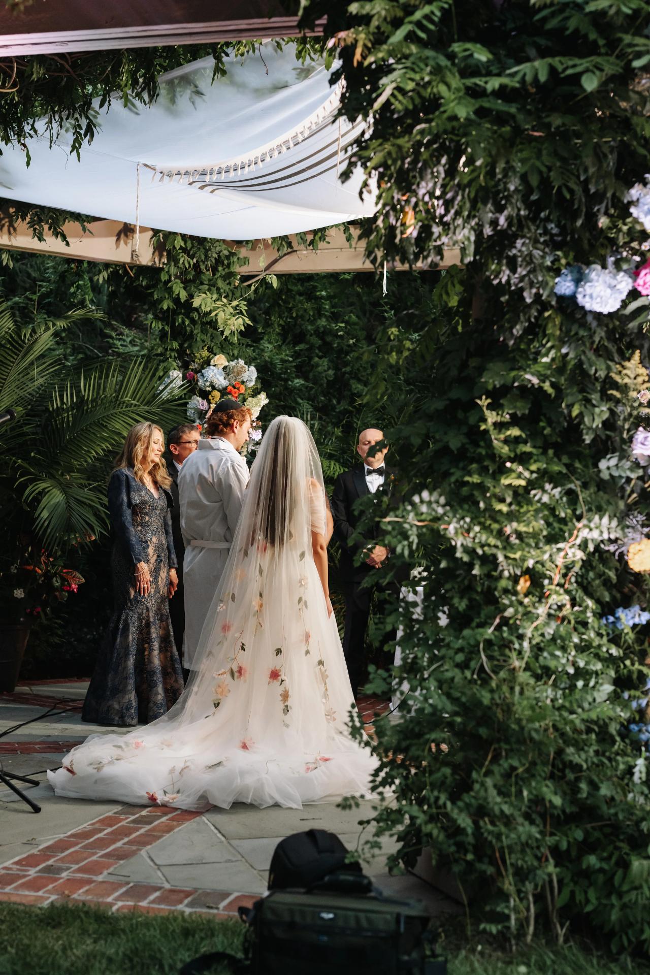 Wide view of the garden chuppah ceremony. Crest Hollow wedding in Woodbury, Long Island.