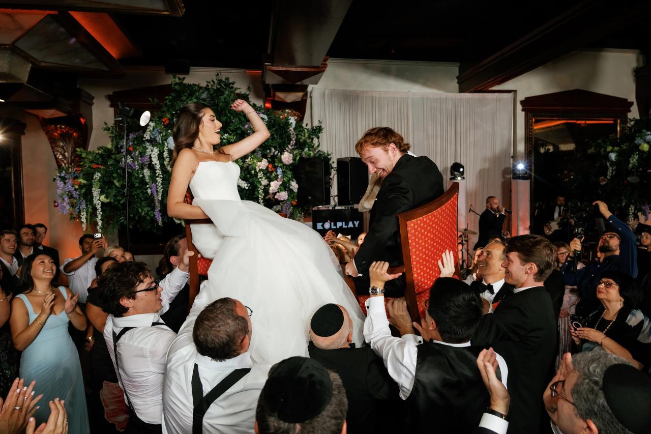 Bride lifted above the wedding dance floor. Crest Hollow wedding in Woodbury, Long Island.