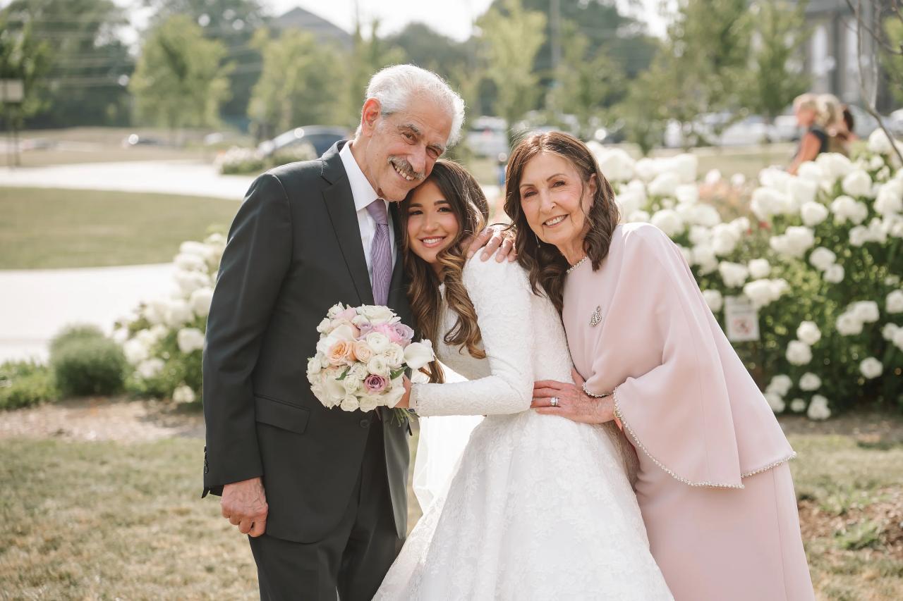 Bride sharing an affectionate portrait with family. Jewish wedding in Detroit.